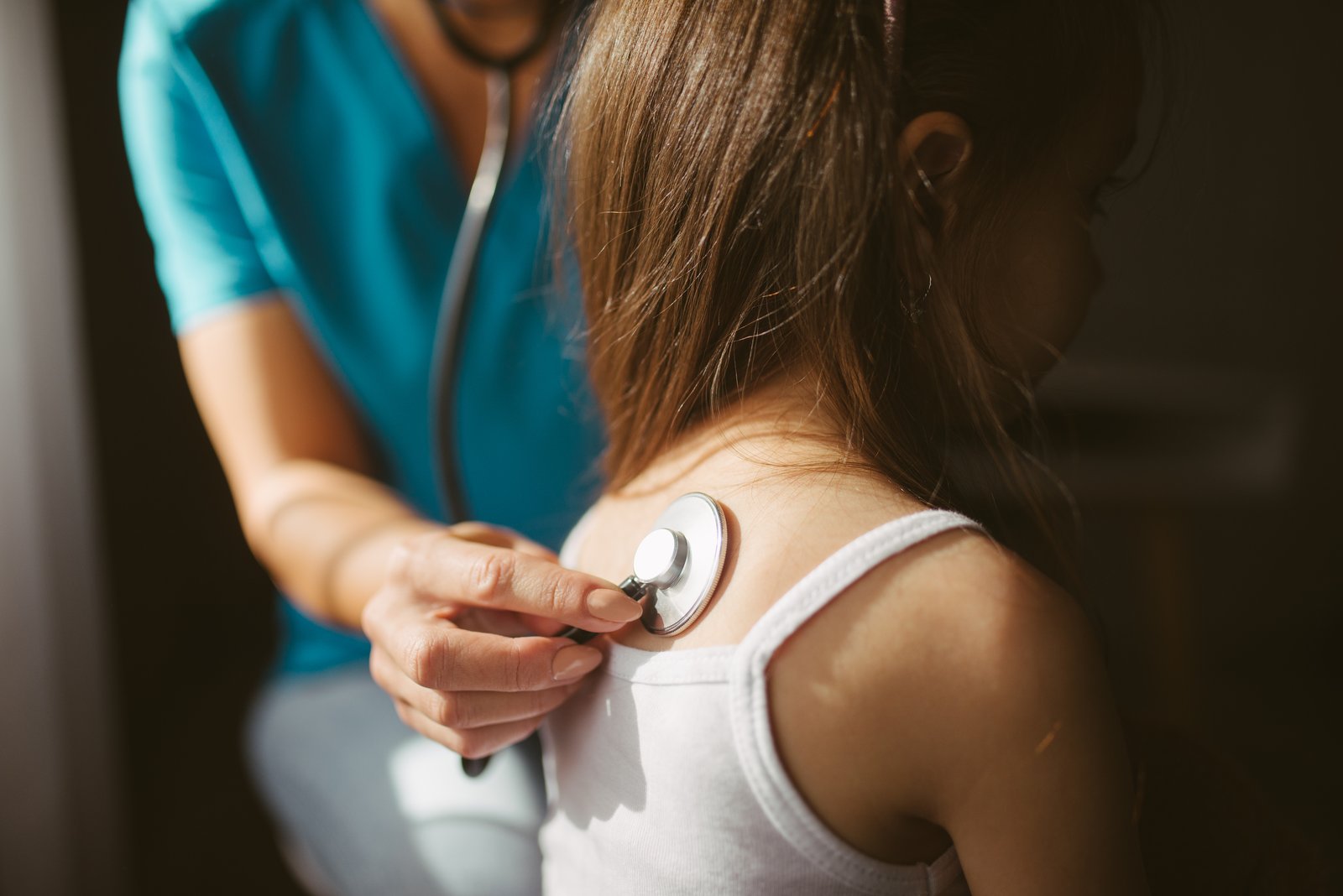 Doctor checking an adult patient's heart during a clinic visit, used as a general illustration for a testosterone therapy safety story