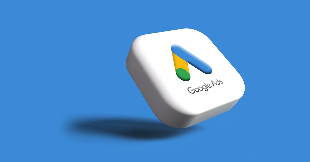 a white google logo on a blue background